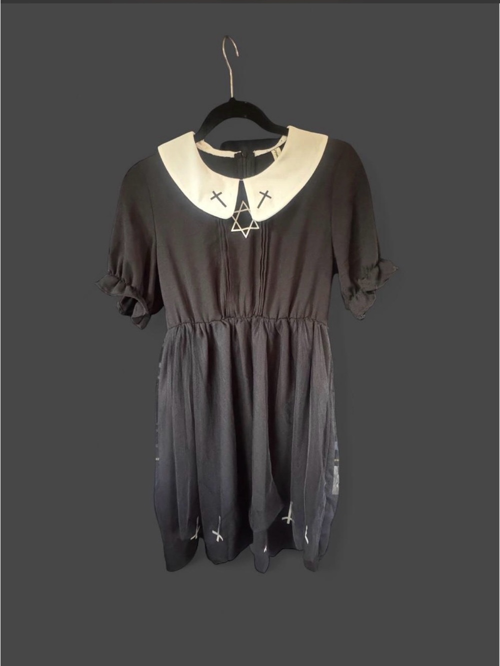 Black dress with white collar and cross details